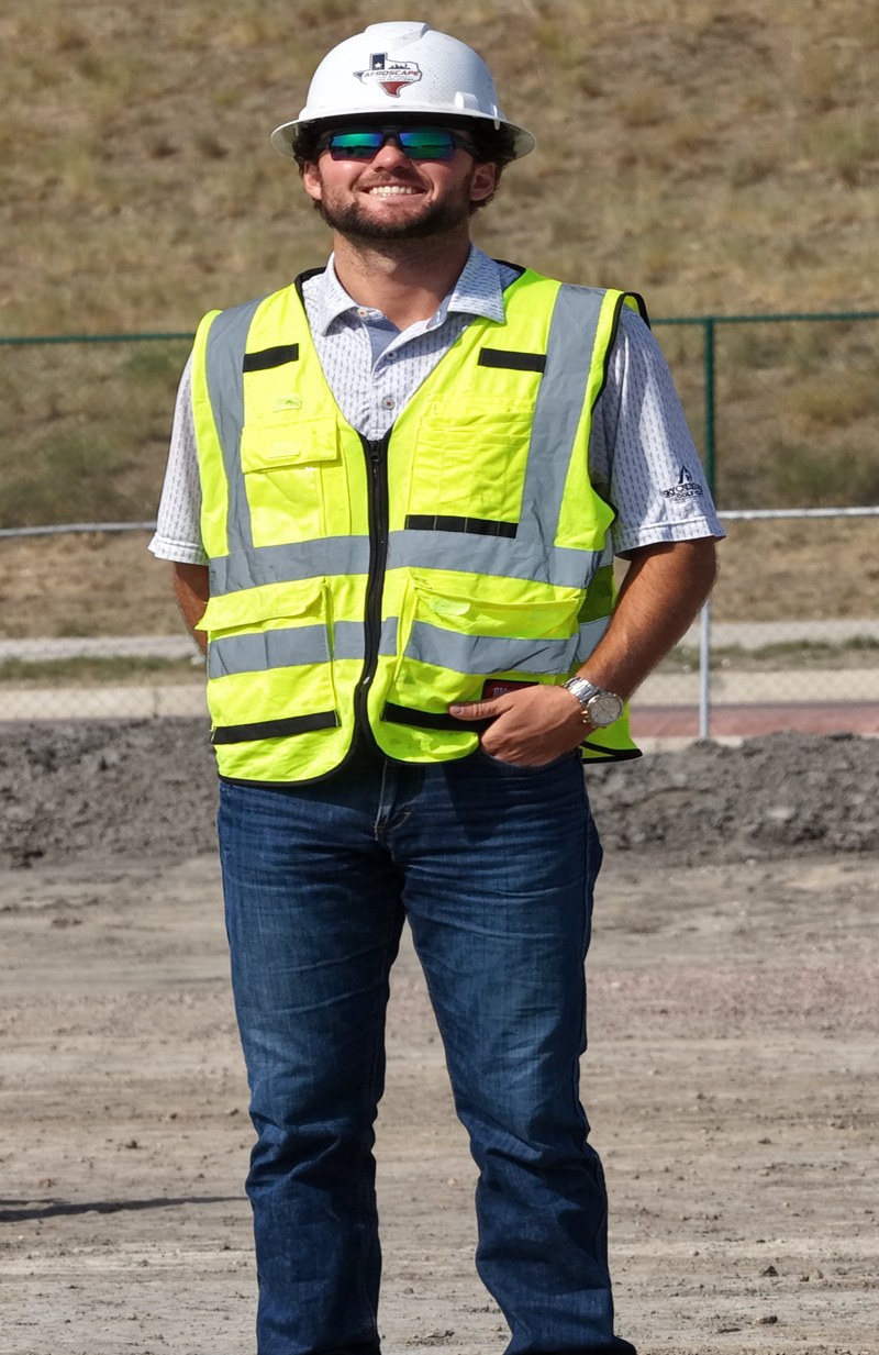 Dylan McCrary, owner and FAA Part 107 certified drone pilot at Aeroscape Drone Solutions, on a construction job site in Fort Worth, TX